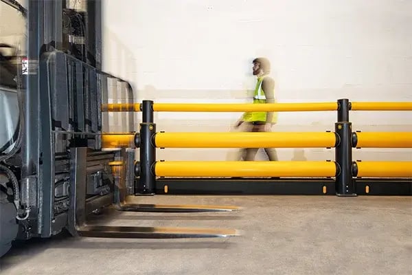flexible forklift guard rail barrier and pedestrian in warehouse