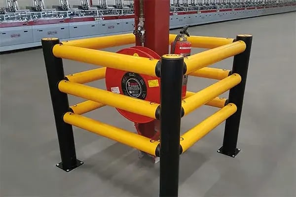a-safe column protection guard rails shield a support column from forklift impacts