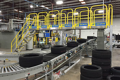 distribution center crossover stairs provide access over a conveyor line