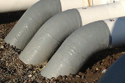 pipes protected from soil line corrosion entering into ground