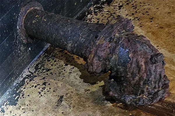 corroded pipe in underground water storage tank