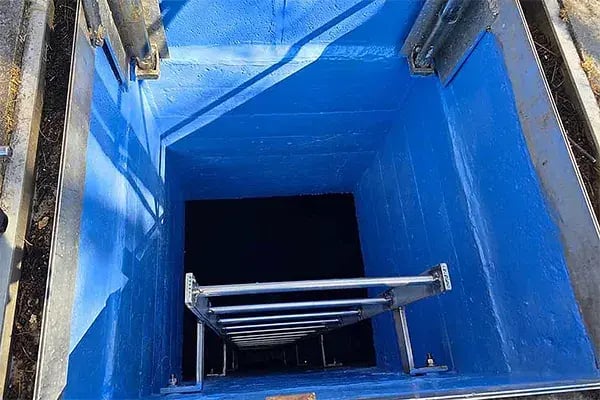 underground water tank entrance coated with blue belzona 5812dw