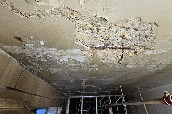 concrete ceiling spall from salt infiltration below loading dock area
