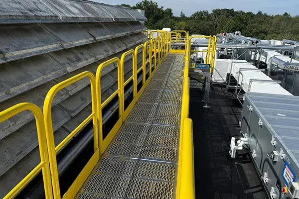 rooftop catwalk maintenance platform provides safe walkway above ducts, pipes and equipment