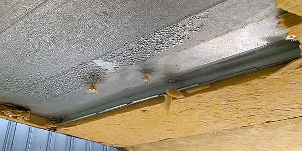 water condensation droplets on the surface of outside hvac duct