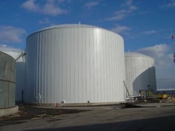 Vertical insulation panels used for a bulk storage tank insulation system