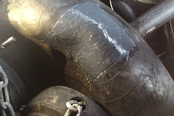 Repaired rubber marine fender