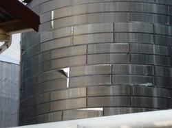 Shifting horizontal insulation panels on a storage tank insulation system