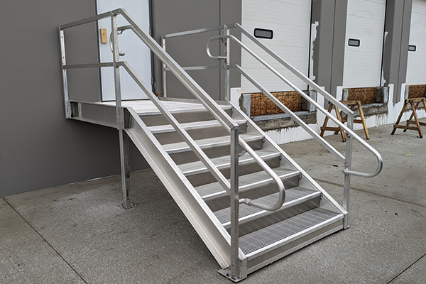 aluminum loading dock stairs at warehouse entrance