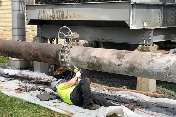 corroded cooling tower pipe restoration prep work