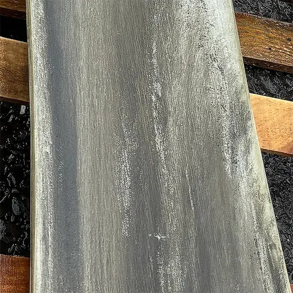 deteriorated cooling tower fan blade shown before restoration