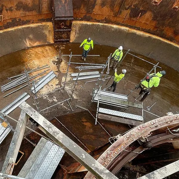 clarifier corrosion repair scaffold assembly by BIG workers