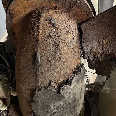 chiller compressor elbow corrosion exposed after insulation removal