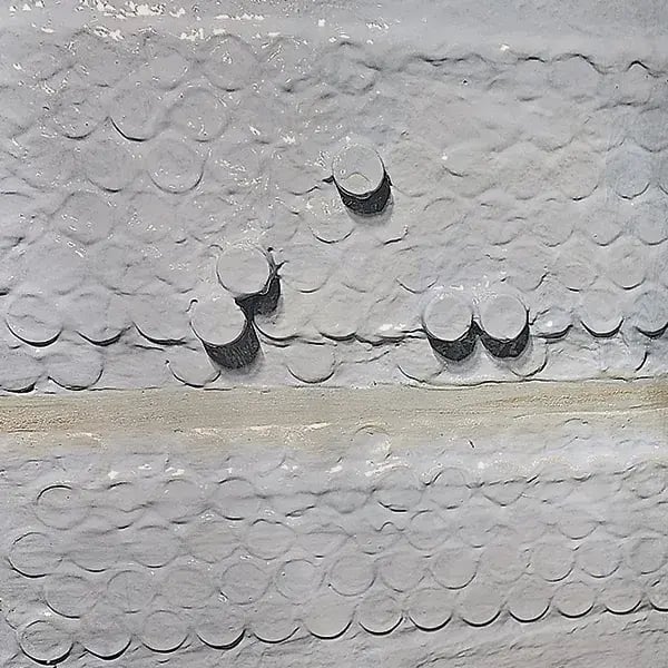 detailed photos showing belzona 1341 gray coating applied to tube sheet