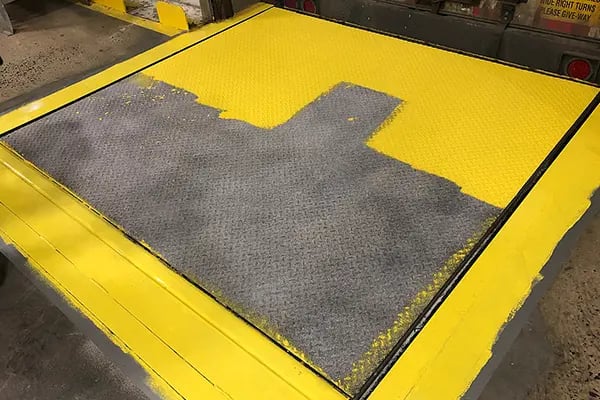 dock leveler anti-slip urethane top coat application in process