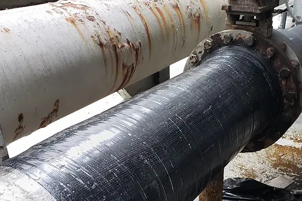 Belzona superwrap used to repair and strengthen corroded metal pipe