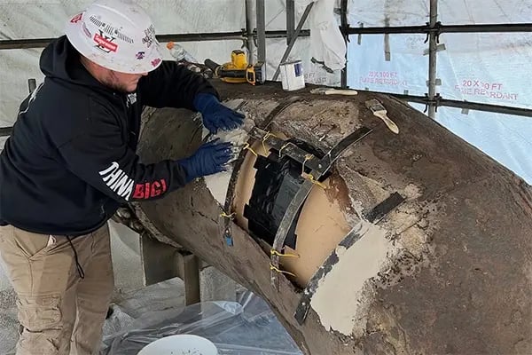 epoxy mortar pipe liner repair work in process