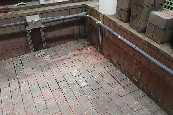 acid brick grout damaged in containment area