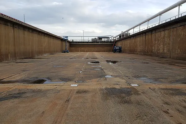 concrete wastewater tank with damaged expansion joint seals