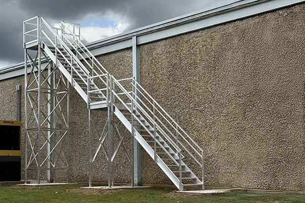 upside innovations APEX aluminum exterior roof access stairs provide OSHA-compliant access to manufacturing facility roof