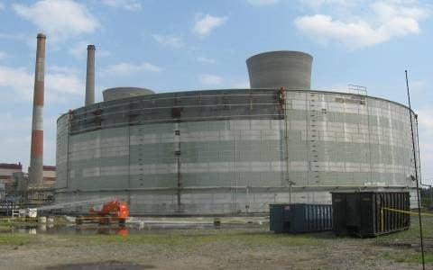 Before: removing horizontal insulation panels of a storage tank insulation system