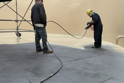 protective epoxy coating is applied to the interior of a storage tank