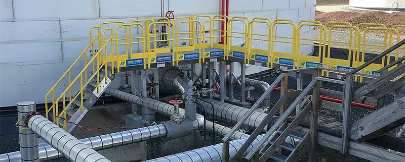 erectastep pipe crossover stairs provide safe access to pipe controls on storage tank