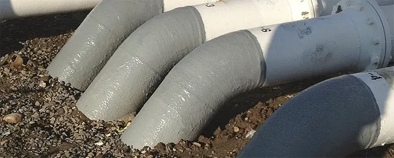 soil line corrosion repair applied to pipes entering the ground