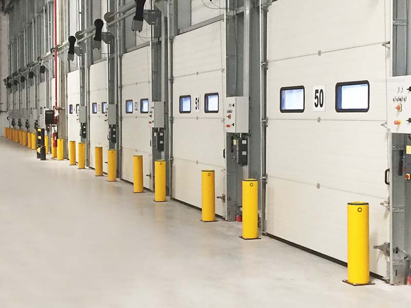 bollards protect loading dock bays from forklift collisions