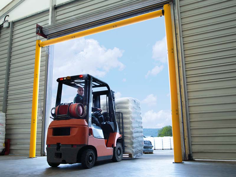 warehouse height restrictor prevents forklift damage to door frame and high level equipment