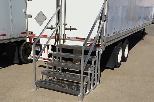 semi-trailer portable steps at rear of storage trailer