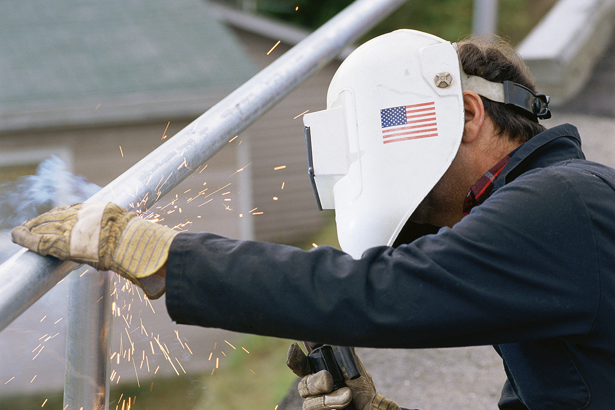 welder working on guard rail