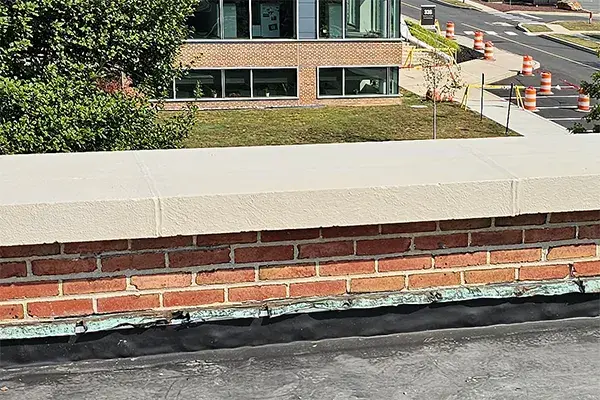 detail showing final capstone repair and limestone grey color protective coating