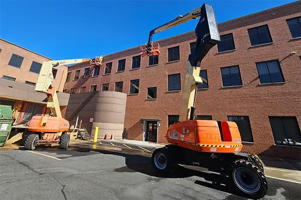 capstone repair work done using aerial work platforms to reach third story