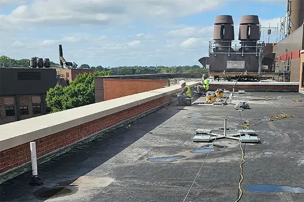 capstone rehabilitation work in process on building rooftop