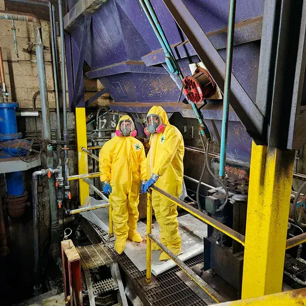 pot perm hoppers with repair work crew in protective suits
