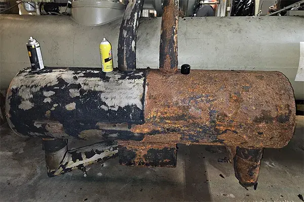 removal of insulation shows corroded chiller economizer