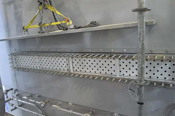 heat exchanger tube sheet coating applied to refurbish corroded tube sheet