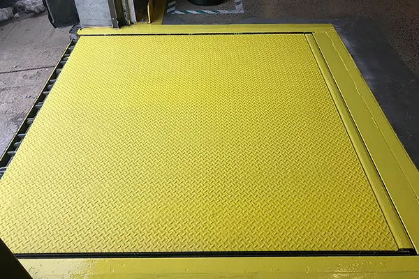 epoxy anti-slip coating applied to loading dock leveler plate
