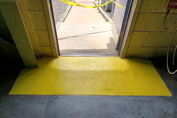 door ramp with anti-slip coating in safety yellow