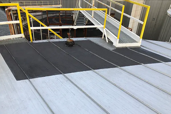 storage tank catwalk with Belzona anti-slip coating applied to tank roof