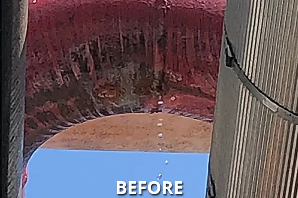water drips from hole in factory pipeline