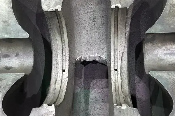 damage from worn pump wear rings prepped for epoxy repair