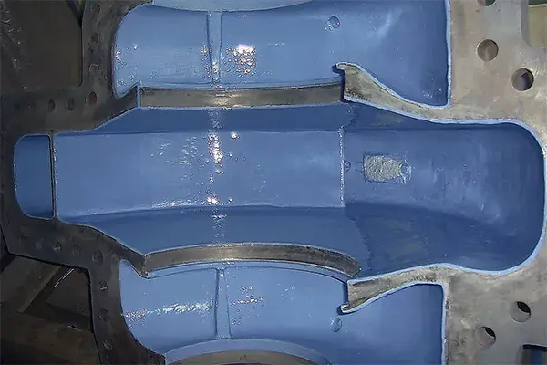 refurbished centrifugal water pump with final coat of blue 2-part belzona 1341 applied