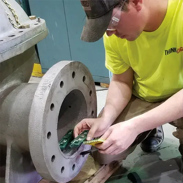 banks industrial group technician prepares split case centrifugal pump for repair work after blasting surfaces to white metal