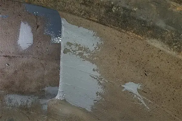worn wastewater pump metal damage repair in process