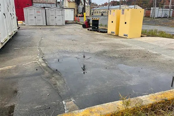 deteriorated concrete hazardous waste drum pad