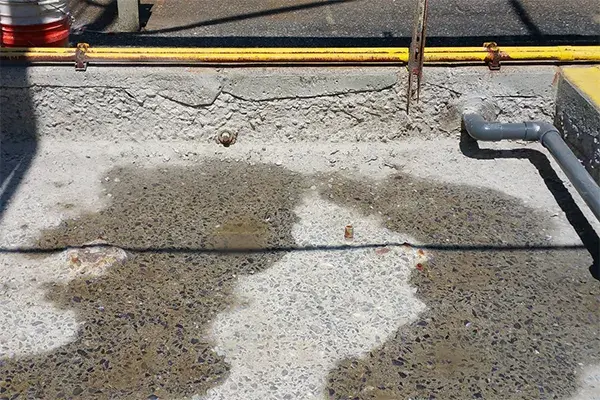 secondary containment area concrete damage prepped for repair