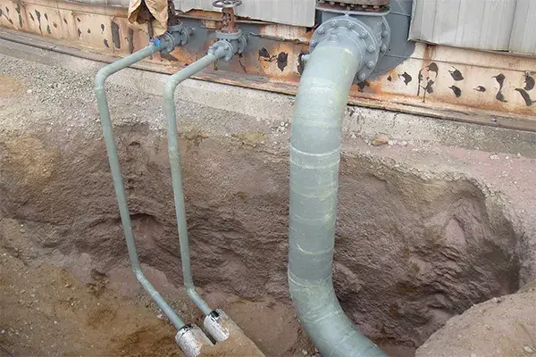 soil line pipe corrosion repair done to pipes from a storage tank entering below ground level