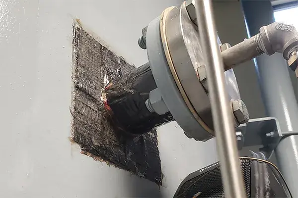 pipe insert tank leak repaired with epoxy paste and carbon fiber patch